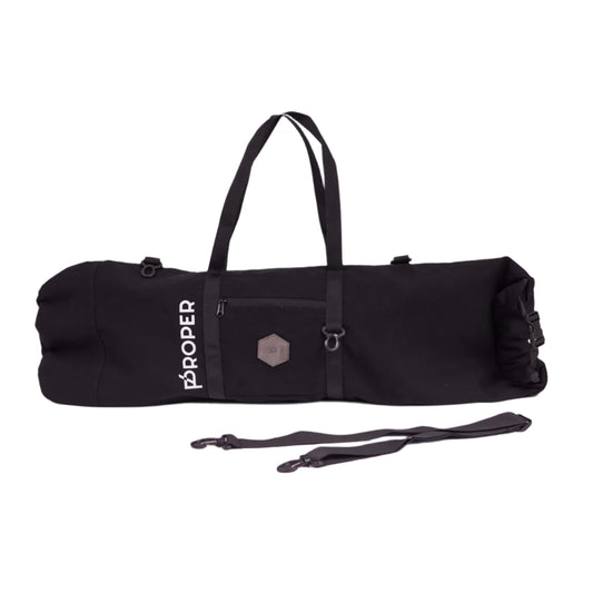 A black Proper Authentic Skate Bag with a shoulder strap, a small front pocket, and a zippered back pocket, made from water-resistant canvas fabric.