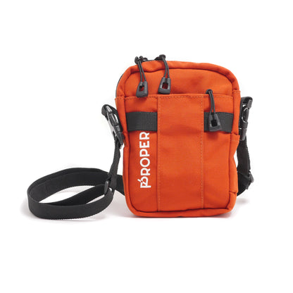 Orange crossbody bag with 'Proper' branding on a white background